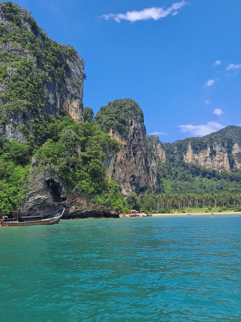 blue sky, green rock, blue water. krabi, thailand.
