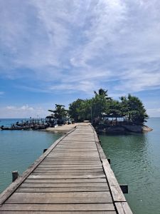 pier on the ocean, blue skies